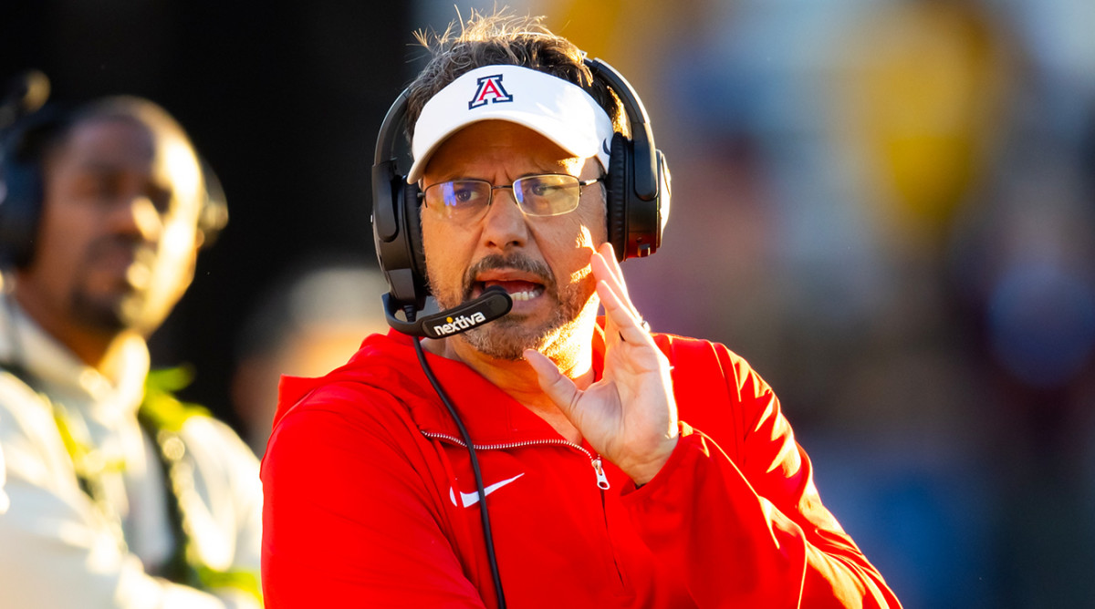 Arizona head football coach Jedd Fisch calls a play from the sidelines.